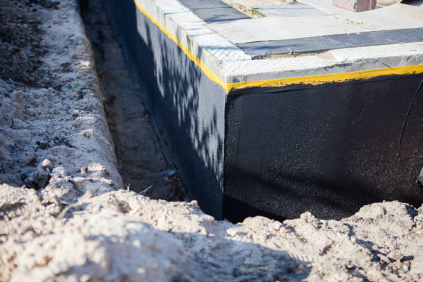 Professional Basement Waterproofing technician working in Portland, TN
